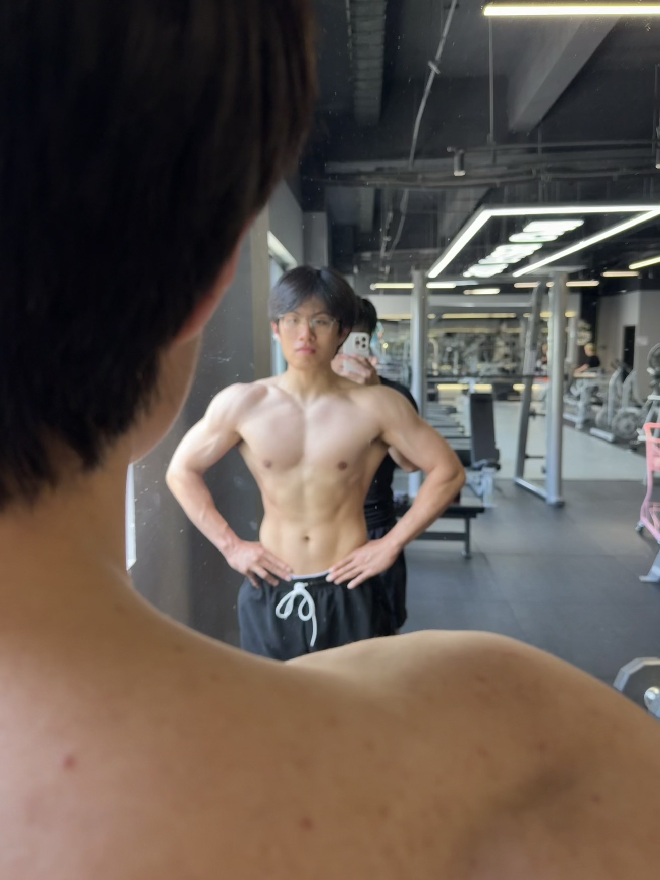 Mirror progress photo at the gym